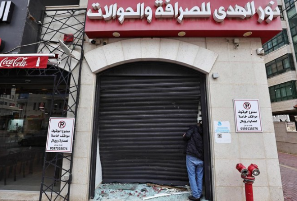money exchange shop, after a raid by the Israeli army,