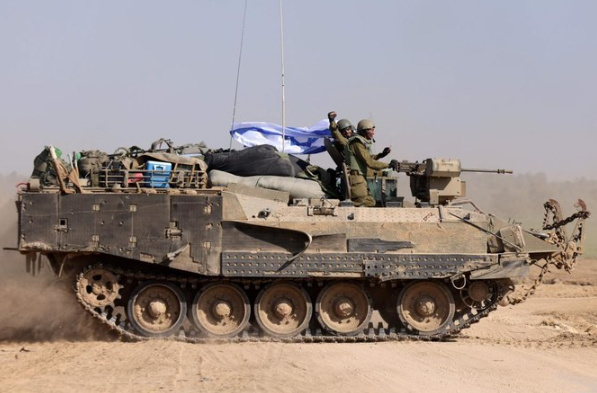 Israeli soldiers on an armored personnel carrier