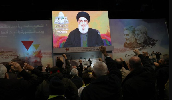 People watch the televised speech of Lebanon’s Hezbollah chief Hasan Nasrallah