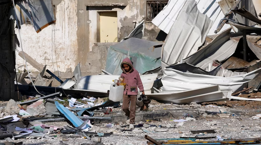 Gaza child wandering in ruins