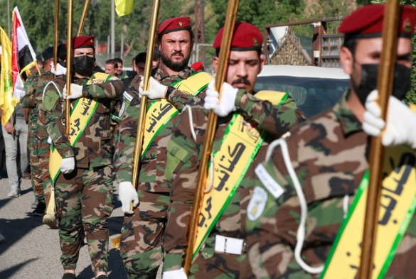 al-Nujaba and Kataib Hezbollah, during a funeral in Baghdad